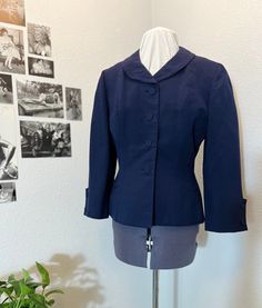 "Vintage 40s Navy New Look Era Suit Jacket and Shell Structured jacket with a sleeveless shell.  Most likely a wool blend.  Shell has a chiffon add on to the bottom for tucking in.   In good condition with no stains, however there are two small holes on the shell's right chest area and a small hole on the left jacket sleeve. Two of the fabric buttons are missing - one on each sleeve. Please see pictures before buying.  Jacket Measurements: Chest: 34\" Waist: 30\" Shoulder: 15.5\" Length: 23.5\" Classic Fitted Outerwear For Daywear, Fitted Single Breasted Blazer For Daywear, Fitted Single-breasted Blazer For Daywear, Elegant Fitted Blazer For Daywear, Retro Fitted Lined Outerwear, Elegant Fitted Outerwear For Vintage Fashion, Elegant Fitted Vintage Fashion Outerwear, Fitted Vintage Workwear Blazer, Fitted Vintage Lined Outerwear