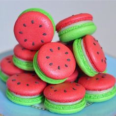 a pile of watermelon macaroons sitting on top of each other