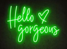 a neon sign that says hello and gorgeous