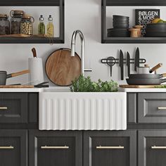 a kitchen with gray cabinets and wooden utensils