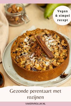 a cake on a plate with cinnamon and star anise