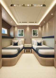 the interior of a boat with two beds on each side and no one in it