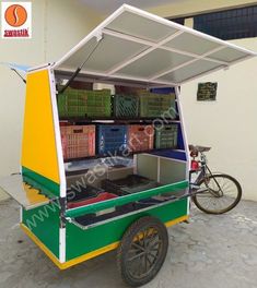 an ice cream cart with baskets on the back