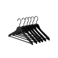 four black hangers are hanging on a white wall