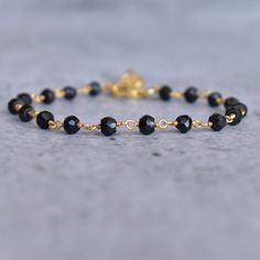 ✦ Discover the power of black onyx with our delightful faceted beaded bracelet. Add a touch of sophistication to any outfit with this stunning black onyx Rosary chain bracelet. It looks like something your favorite A-lister would wear! These beads are said to offer protection against negative energy and ground you, helping to promote self-control whilst still remaining an essential accessory. Make sure to grab one before they're gone - every fashionista needs one of these statement pieces in the Black Gemstone Beads Rosary Bracelet Gift, Black Rosary Bracelet With Gemstone Beads As Gift, Black Faceted Jewelry For Everyday, Black Faceted Everyday Jewelry, Everyday Black Faceted Jewelry, Elegant Black Rosary Bracelet With Round Beads, Elegant Black Faceted Bracelet, Elegant Black Rosary Bracelet, Elegant Onyx Crystal Bracelet Adjustable