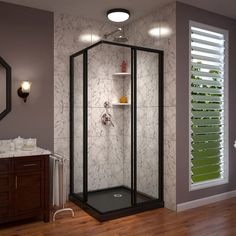 a bathroom with a walk in shower sitting next to a sink and a mirror on the wall