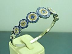 Material= 925 Sterling Silver Stone/Stones=Sapphire&Citrine&Zircon Style= Eastern Bangle Width (mm)=18x55 Wrist Diameter(mm)=56x60 Weight(gr)=10,9 Coating=None Item Specify=Evil Eye Design Sapphire Cubic Zirconia Bracelets, White Gold Multi-stone Round Bracelet, Cubic Zirconia Multi-stone Bangle, Multi-stone Cubic Zirconia Bangle, Multi-stone Round Bangle, Sterling Silver Diamond Bracelet With Gemstone, Sterling Silver Multi-stone Bracelet, Hand Set Sapphire Bracelet Jewelry, Round Cubic Zirconia Bracelets With Stones