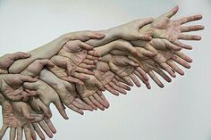 many hands reaching out to each other