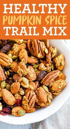 healthy pumpkin spice trail mix in a white bowl with text overlay that reads healthy pumpkin spice trail mix