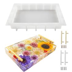 the plastic tray has flowers on it and is ready to be put into the container