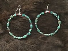 Authentic Beautiful Navajo Zuni oversized hoop earrings with Rare Nevada Turquoise and Sterling Silver Beads.  Handcrafted by Navajo Artist Harriet Crosby Great for a Gift ❤️ Earrings are 2.25" Hoop Earrings are SO popular right now.. These are perfect for Hoop Lovers! They are large enough to be seen from a far. Perfect hoops to go with Jeans and Boots! Southwestern Adjustable Hoop Jewelry, Southwestern Style Adjustable Hoop Jewelry, Handmade Southwestern Turquoise Hoop Earrings, Southwestern Jewelry With Round Beads For Pierced Ears, Southwestern Turquoise Nickel-free Hoop Earrings, Turquoise Southwestern Nickel-free Hoop Earrings, Southwestern Turquoise Hoop Earrings Nickel Free, Nickel-free Southwestern Hoop Earrings, Nickel-free Southwestern Style Round Hoop Earrings