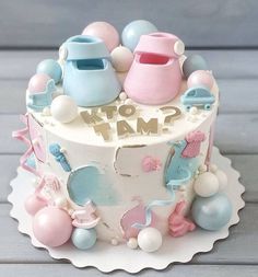 there is a cake decorated with baby items on the top and words that read to me?