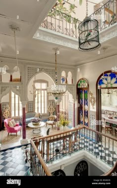 an ornately decorated staircase leads to the second floor