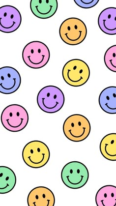 many different colored smiley faces on a white background