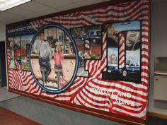 an office decorated with american flags and pictures