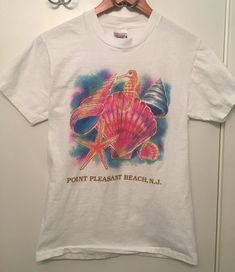 Vintage Point Pleasant Beach Pastel Shell Seahorse Tee. Has a slightly puffy look to the print! Excellent vintage condition, please see all photos. Ships with USPS. Vintage Printed T-shirt For Vacation, 90s Printed Multicolor T-shirt, 90s Style Printed Multicolor T-shirt, Vintage Screen Print T-shirt For Beach Season, Vintage Graphic Print Beach T-shirt, Vintage Graphic Print T-shirt For Beach Season, Vintage Graphic Print T-shirt For Beach, Multicolor Graphic Print T-shirt For Beach Season, Vintage Pre-shrunk T-shirt For Beach