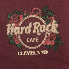 the hard rock cafe logo is shown on a maroon t - shirt that says cleveland