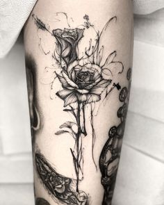 a black and white photo of a flower on the leg