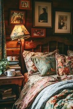 a bed sitting in a bedroom next to a table with a lamp on top of it