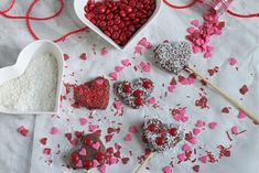 valentine's day treats on a table with hearts and sprinkles around them