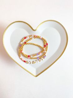 Seasonal Valentine Stacks Beaded Heart Bracelet Pre-made - Etsy Personalized Gold Beaded Bracelet For Valentine's Day, Gold Beaded Bracelet For Valentine's Day Personalized Gift, Personalized Letter Beads Jewelry For Valentine's Day, Valentine's Day Personalized Letter Beads Jewelry Gift, Valentine's Day Personalized Letter Beads Jewelry, Dainty Beaded Bracelets With Heart Charm For Friendship, Heart Beads Friendship Bracelet For Valentine's Day, Heart Beads Name Bracelet For Valentine's Day, Personalized Heart Bracelet With Round Beads For Valentine's Day