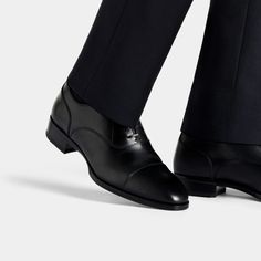 A classic pairing to formal suits, these timeless black Oxfords are crafted in Italy from supple Italian calf leather in a Blake stitch, and feature full leather lining and sole. Black Cap Toe Semi-formal Loafers, Fitted Black Leather Shoes For Semi-formal Occasions, Luxury Semi-formal Cap Toe Loafers, Classic Formal Loafers With Brogue Detailing, Classic Calf Leather Oxfords With Plain Toe, Classic Brogue Loafers For Formal Occasions, Luxury Fitted Loafers For Office, Timeless Formal Loafers With Brogue Detailing, Timeless Formal Wingtip Leather Shoes