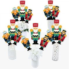 nutcrackers and flowers are arranged in vases