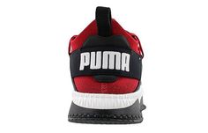 a red and black sneaker with the word puma on it