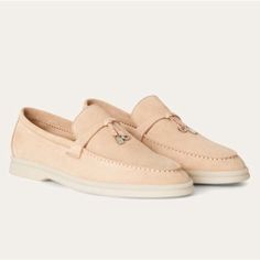 Loro Piana Summer Charms Walk Suede Loafers In Pink Sand Suede Size 36 Exceptionally Comfortable, Sporty Loafers Made From Soft Suede. They Are Enhanced With Non-Marking Rubber Soles A Common Feature Of All Loro Piana Sportswear Shoes. The Front Saddles Are Embellished With Mini My Charms. Perfect For Summers Spent Sailing, At The Beach Or In The City. Minimalist Luxury At Its Finest. Excellent Preloved Condition *Minor Wear On Sole Bottoms, Very Faint Marks On The Medial Side Seen Last Photo Lo Elegant Suede Tassel Loafers, Elegant Beige Tassel Loafers For Formal Occasions, Elegant Beige Plain Toe Moccasins, Luxury Beige Flats For Formal Occasions, Elegant Beige Moccasins With Removable Insole, Elegant Slip-on Loafers With Suede Lining, Luxury Beige Almond Toe Moccasins, Elegant Slip-on Moccasins With Suede Lining, Elegant Suede Slip-ons With Textured Sole