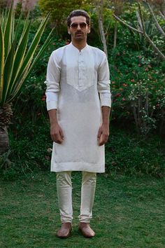 Sunset orange bundi with floral thread embroidery. Paired with a kurta with pintuck details and off white churidar. - Aza Fashions Off White Churidar, Floral Thread Embroidery, White Churidar, Kurta Set Men, Nehru Jacket, Sunset Orange, Nehru Jackets, Silk Linen, Thread Embroidery