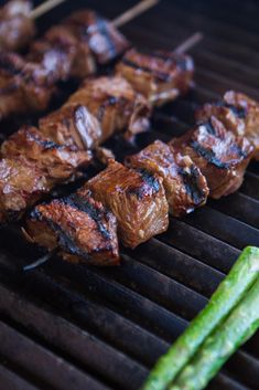 some meat is being cooked on a grill