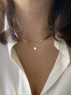 Ships out in: 3 to 5 business days The 14k gold Herringbone Chain Necklace is currently having a moment but truth is, it’s been a staple piece for decades. Draped like liquid gold around your neck, this surprisingly lightweight chain is perfect for a solo statement or as an anchor for a layered minimalist look. Recycled 14k gold 2.8mm chain Adjustable 16-18" length Elegant Double Chain Herringbone Necklace As Gift, Elegant Herringbone Necklace With Double Chain Gift, Modern Double Chain Necklace As Gift, Elegant Everyday Chain Necklace With Snake Shape, Elegant Everyday Snake Shape Chain Necklace, Elegant Snake-shaped Chain Necklace For Everyday Wear, Modern Clavicle Snake Chain Necklaces, Classic 14k Gold Herringbone Necklace With Delicate Chain, Modern Necklace With Clavicle Snake Chain