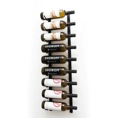 a wine rack that has six bottles on it and is holding several different types of wines