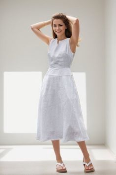 Keep it fresh and fashionable this summer with our Linen Midi Dress. This sleeveless, split neck white dress, perfectly designed for those hot summer days, ensures you stay comfortable while looking chic.  ★★FEATURES 100% Linen Two side pockets White cotton lining Split V neck dress Right hidden zipper Sleeveless Linen dress Linen midi dress Below knee length Minimalist Dress Perfect for summer,spring Other more color selection ★★ Bespoke Order Service If you Request other color Request the leng White Casual Midi Length Sleeveless Dress, Chic White A-line Linen Dress, White Sleeveless Floral Summer Dress, White Casual Midi Sleeveless Dress, White Sleeveless Summer Mini Dress, White Sleeveless Mini Dress For Summer, White Sleeveless Evening Dress For Summer, White Sleeveless Linen Sundress, White Sleeveless Summer Sundress