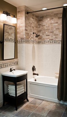 a bath room with a sink and a bath tub