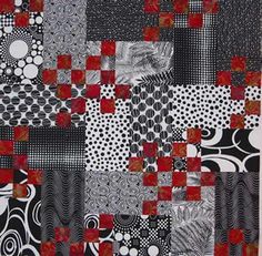 a piece of art that is made out of black and white fabric with red squares