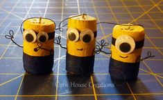 three candles made to look like minion faces