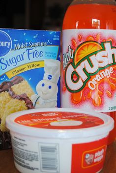 an orange drink and some other food items on a table with the words sugar free, crush orange next to it