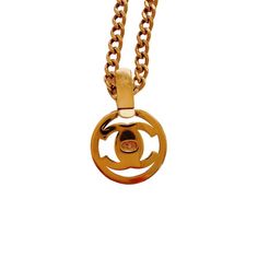 Authentic Chanel circa Fall 1997  In excellent vintage condition  24kt gold plated hardware- no signs of tarnish  Turnlock closure  Comes with original box  Chain measures 22″ in length  Pendant measures 2 1/4″ in length by 1 1/2″ in width Vintage Gold Necklace With Gold-tone Logo Plaque, Designer Gold Hallmarked Necklace, Vintage Necklace With Logo Charm For Formal Occasions, Luxury Gold-plated Jewelry With Gold-tone Logo, Classic Formal Jewelry With Logo Charm, Elegant Formal Necklace With Gold-tone Logo Plaque, Formal Yellow Gold Jewelry With Logo Charm, Elegant Gold Necklace With Logo, Luxury Gift Necklace With Gold-tone Logo Plaque