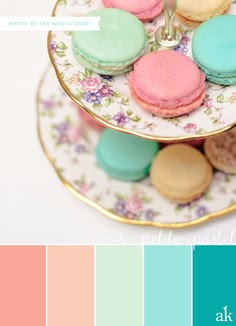 there is a plate that has some cookies on it and the colors are blue, pink, green, yellow