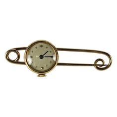 Charming Gold Watch Safety Pin set in 14k gold from the 1940's. Great design with watch that swivels from the safety pin for easy viewing. The safety pin is made with one gold wire that forms an elegant self closure. Super versatile and great for a lapel or closing a shirt. 2" length, Watch .6" across. 1940's. Watch functions. Made by Pery. Great Design, Gold Wire, Safety Pin, Gold Watch, Pocket Watch, Brooches, Jewelry Accessories, Brass, Gold