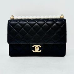 Chanel 2019 Quilted Small Chic Pearl Flap Bag with Interlocking CC Turn-lock and Gold-tone Hardware (with Dustbag) Designer = Chanel Color = Black Material = Leather Condition = Very Good Height = 6 Width = 8.5 Depth = 1.5 Class = Premier Location: Chicago Item Number: 19740-126 Item ID: 298142 Category: Shoulder Bag Chanel 2019, Chanel Purse, Suit Shoes, Luxury Purses, Loafer Mules, Pump Sandals, Handbag Shopping, Flap Bag, Handbag Backpack