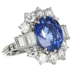 Immerse yourself in the timeless allure of this ring, a creation that embodies the perfect blend of elegance and meaning. Each gaze reveals a story of craftsmanship, where the deep "Royal Blue" hue of the central sapphire captures the essence of a starry night sky, invoking a desire for infinity and a sense of eternity. To wear it is not just a statement of style, but an adoption of power, a symbol of a love as rare and profound as the gem that adorns it. Technically speaking, this jewel is a tr Luxury Royal Blue Sapphire Ring, Luxury Classic Royal Blue Ring, Royal Blue Gemstone Fine Jewelry, Luxury Royal Blue Gemstone Jewelry, Royal Blue Brilliant Cut Fine Jewelry Rings, Deep Royal Blue, Royal Jewels, Vintage Jewels, Baguette Diamond