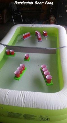 an inflatable beer pong table with cups on it and the words battleship beer pong was a great success