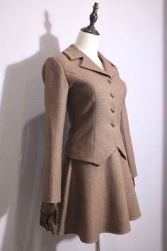 Elegant Formal Wool Skirt Suit, Classic Winter Semi-formal Skirt Suit, Classic Winter Skirt Suit For Semi-formal Occasions, Elegant Wool Skirt Suit For Formal Occasions, Elegant Fitted Winter Skirt Suit, Classic Long Sleeve Skirt Suit For Tailoring, Classic Tailored Wool Skirt Suit, Classic Fitted Wool Skirt Suit, Winter Formal Fitted Skirt Suit