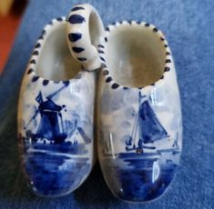 two blue and white shoes with boats on them