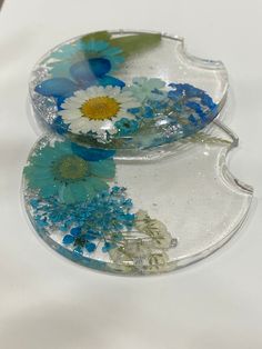 two glass dishes with blue and white flowers on them