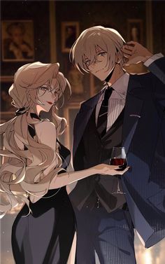 two people standing next to each other holding wine glasses