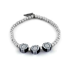 Show off your sporty side with this volleyball bracelet! Make a fashion statement while representing your love for the game. Bracelets are 'one size fits most' and are designed to fit wrists up to 7.5" comfortably. Lead & Nickel Free Please be aware that due to the unique and handmade nature of each product, colors, shapes, and bead sizes may vary slightly from the photos and descriptions. Volleyball Bracelets, Pillow Stack, Bar Card, Bead Sizes, Sports Bracelet, Pillow Box, Bar Bracelets, Name Bracelet, Custom Bracelets