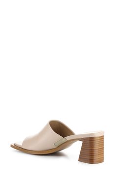 A squared-off toe and stacked block heel balance a minimalist slide sandal set on a cushioned footbed for comfortable wear. 2 1/2" heel Cushioned footbed Leather upper/synthetic lining and sole Made in Italy Beige Open Toe Mules With Stacked Heel, Beige Mules With Sculpted Low Heel, Beige Mules With Stacked Low Heel, Beige Mules With Wooden Block Heel, Modern Open Toe Slides With Stacked Heel, Modern Slides With Sculpted Heel For Spring, Casual Sandals With Square Toe And Stacked Heel, Open Toe Mules With Stacked Heel, Casual Square Toe Sandals With Stacked Heel